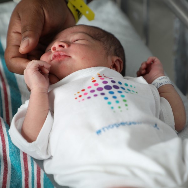 Newborn baby in crib