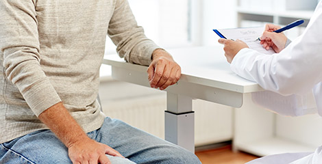 Patient sitting with doctor to discuss care