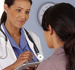 Primary care physician talking with patient