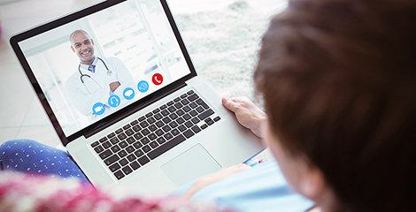 Woman talking to doctor during telehealth appointment