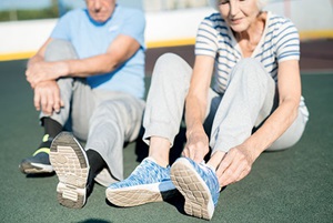 Seniors lacing up their sneakers to get ready to exercise