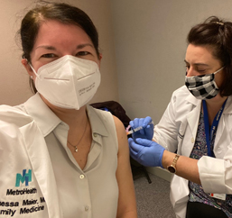 Dr. Maier receiving COVID-19 shot