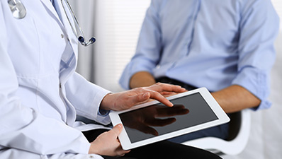 Medical professional discussing Snapshot Skin Screening Service at MetroHealth
