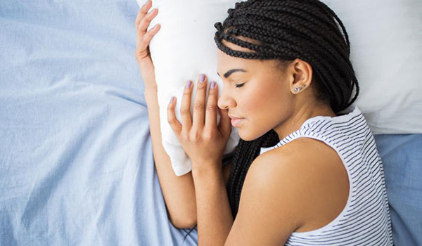 Woman sleeping in bed