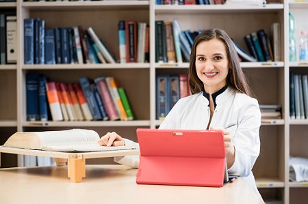 Female doctor studying for CME class