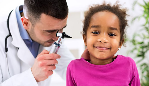 OTOLARYNGOLOGY-doctor-examining-little-girl-ear