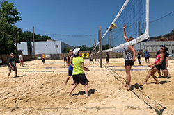 Participants of MetroHealth's 2019 Raising the NETs event play volleyball at the July 13, 2019 event