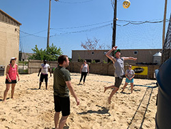 Participants of MetroHealth's 2019 Raising the NETs event play volleyball at the July 13, 2019 event