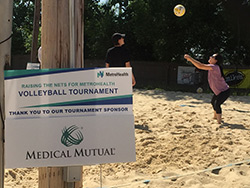 Participants of MetroHealth's 2019 Raising the NETs event play volleyball at the July 13, 2019 event