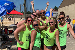 Participants of MetroHealth's 2019 Raising the NETs event play volleyball at the July 13, 2019 event
