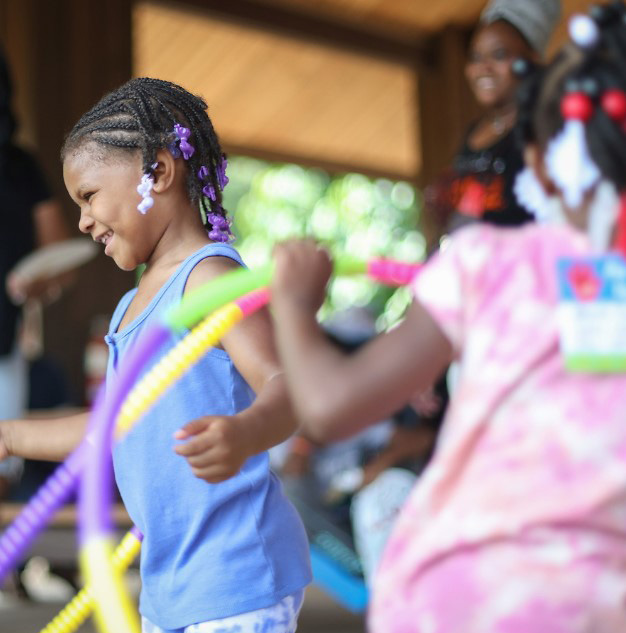 Girls dancing with hula hoops