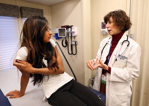 Dr Alexander talks with a patient