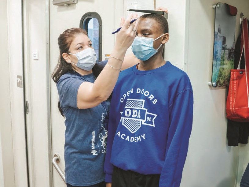 Student getting height measured