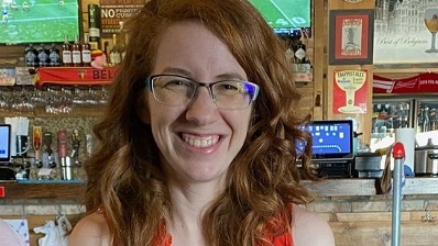 Caitlyn Young sitting in a restaurant