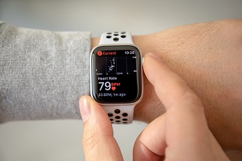 Person checking iphone watch health app