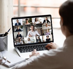 Woman interacting with other attendees to virtual event
