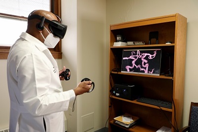 Deven Reddy MD demonstrates virtual reality surgical technology at MetroHealth