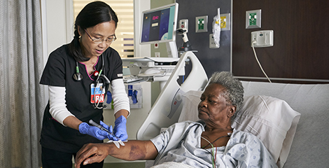 Nurse taking care of older patient