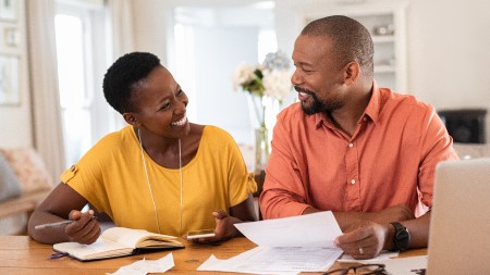 A couple sitting at home discussing bills