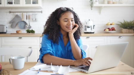 Person smiling at computer