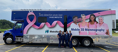 Mobile 3D Mammography Team poses in from of the Mobile 3D Mammography truck