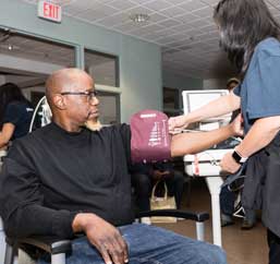 Man having blood pressure checked