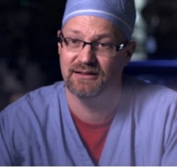 Jeffrey Claridge, MD on the trauma unit in scrubs