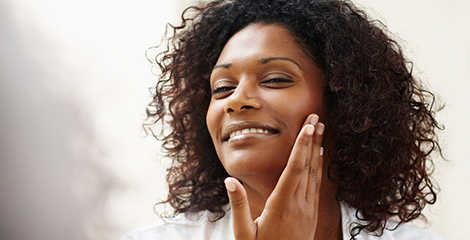 Woman examining her skin