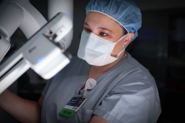 Doctor Dorsey using robotic surgery equipment