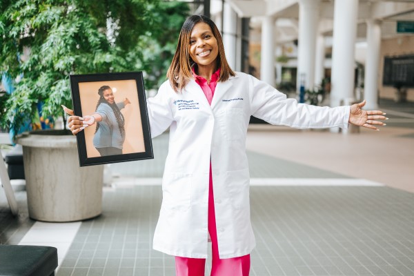 Angel Williams APRN-CNP holding a picture of herself from before weight management treatment
