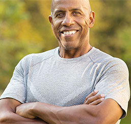 Man smiling after exercising as part of a weight loss program