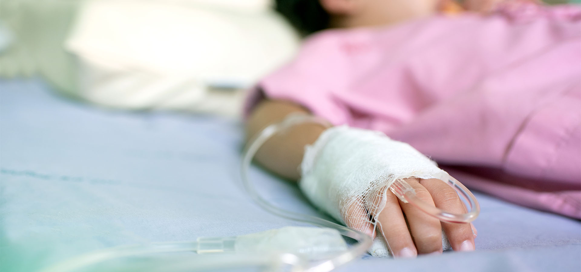 Child with IV in hand