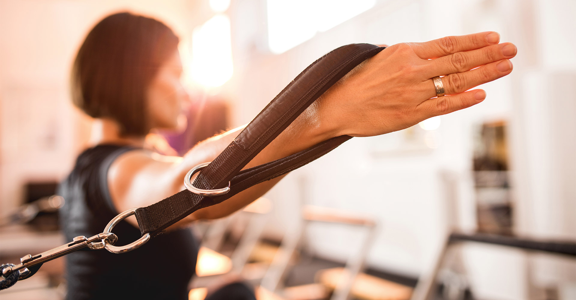 Up close image of woman doing pilates