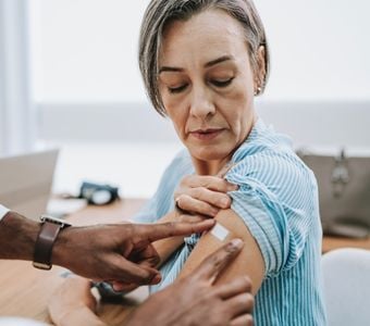 A woman getting a flu shot