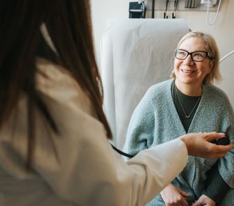 A patient talking with her doctor