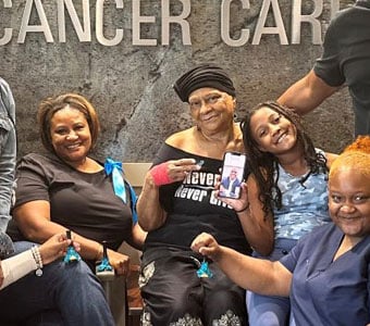 Patricia Williams surrounded by family and MetroHealth providers