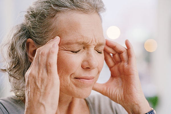 A woman experiencing a headache