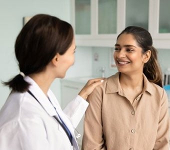A patient talking with her OBGYN provider