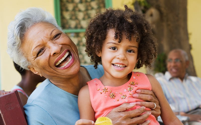 A laughing grandmother and granddaughter