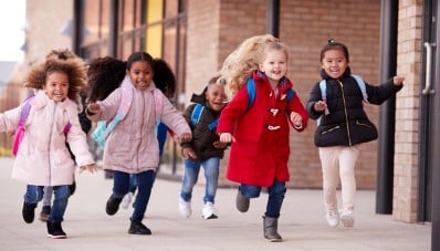Children running into school card