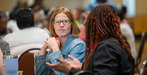 Community Health workers talking at conference