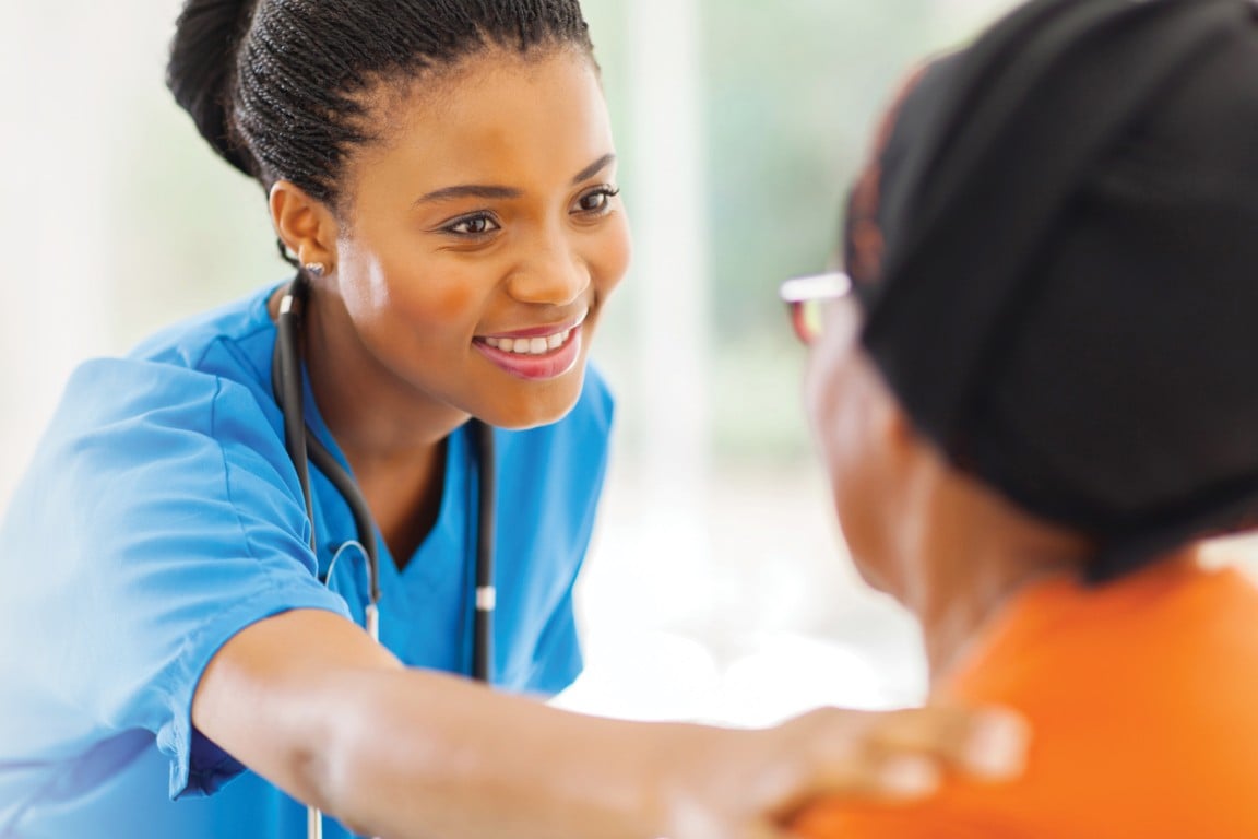 Healthcare provider reassuring her patient