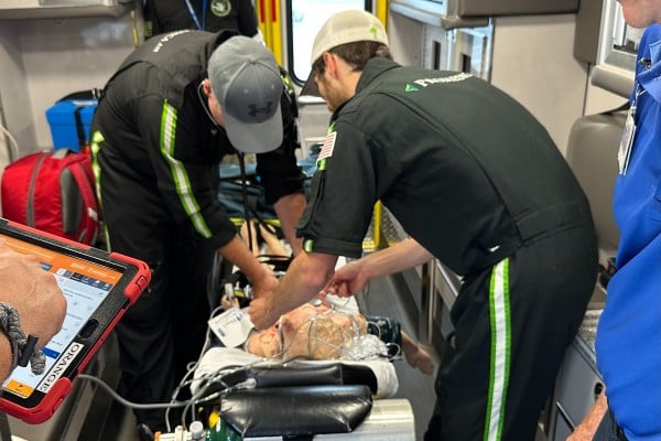 Paramedics working in the back of an ambulance