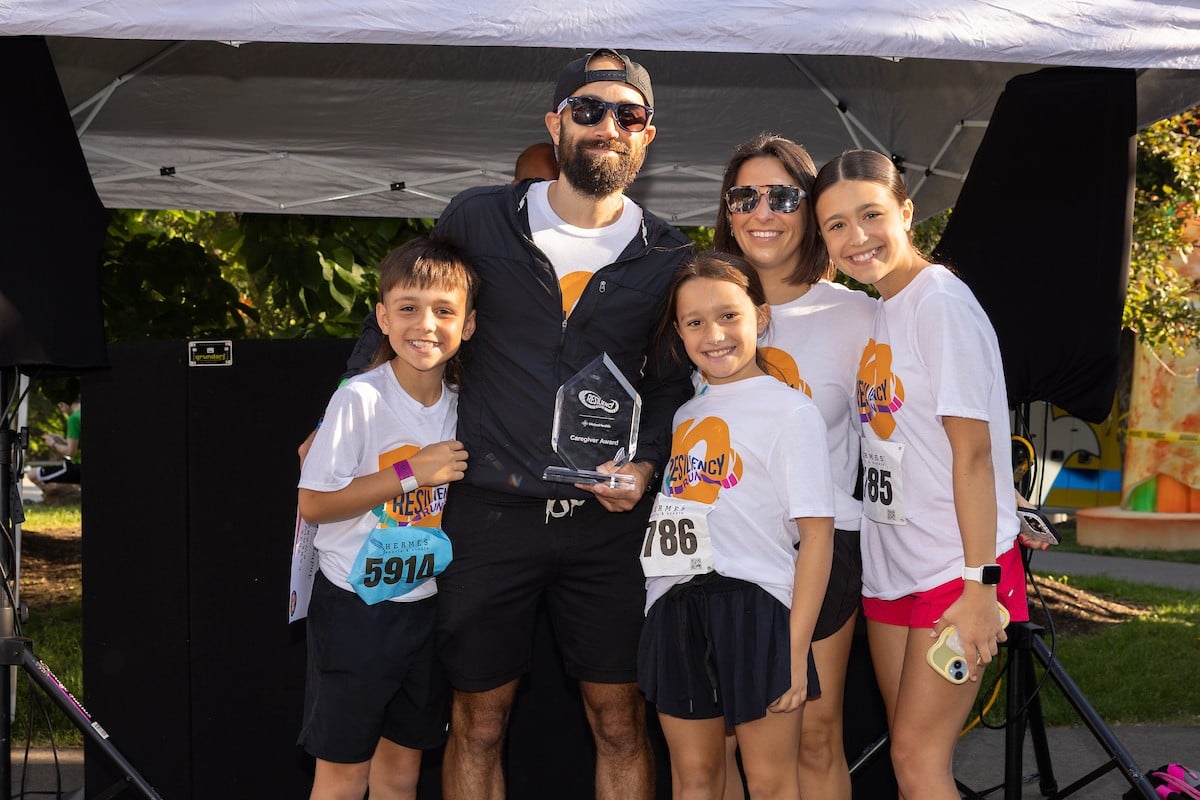 Andrew Neading with his award and his family