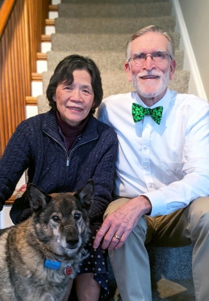Drs. Connors and Lam at home with their dog