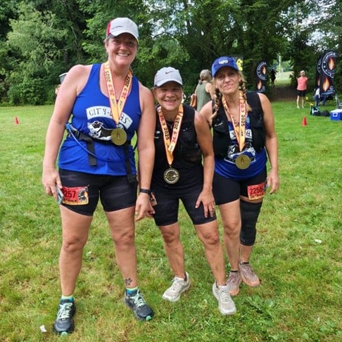 Diane Dunleavy after a marathon, wearing a medal