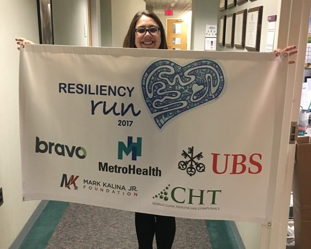 Tina Nickell with the 2017 Resiliency Run banner