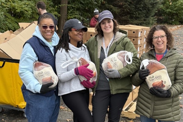Kristen Matlack and MetroHealth employees distributing turkeys for Thanksgiving
