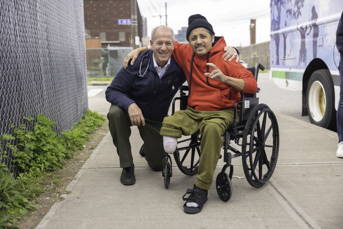 Dr. Seidman and a patient in a wheelchair
