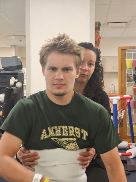 Brody with a member of his rehabilitation team